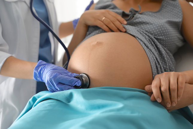 milkie blog doctor-examining-woman-before-giving-child-birth-maternity-hospital-closeup